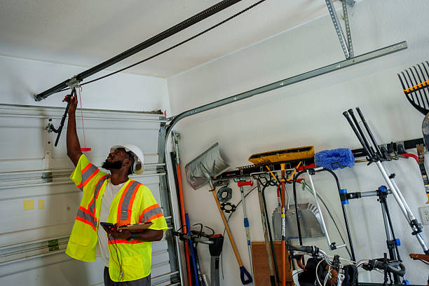 Professional Garage Door technician working in Ives Estates, FL